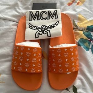 Orange mcm rubber slides